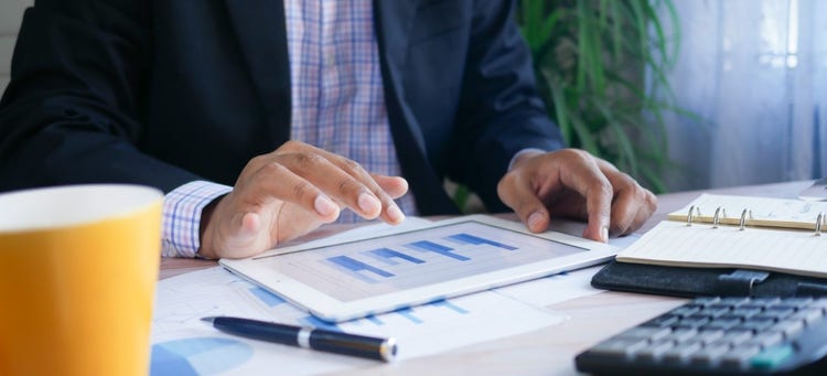 looking at graphs on a tablet about the RBA made their May announcement.