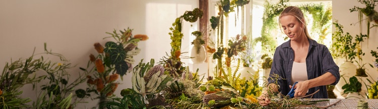 Owner from Stem Design preparing flowers