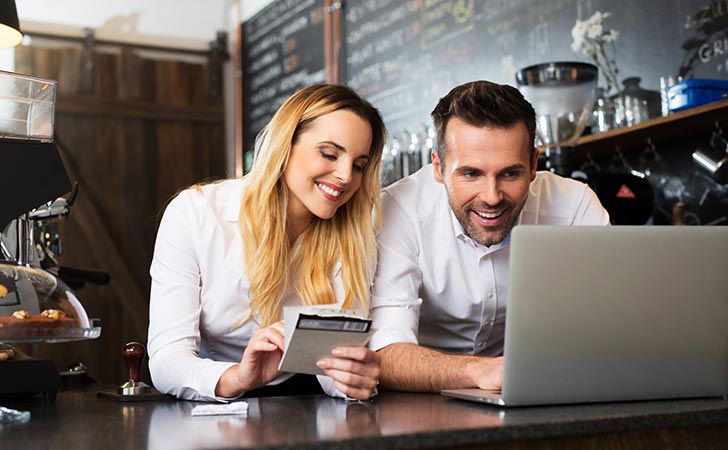 Couple learning about opening a business