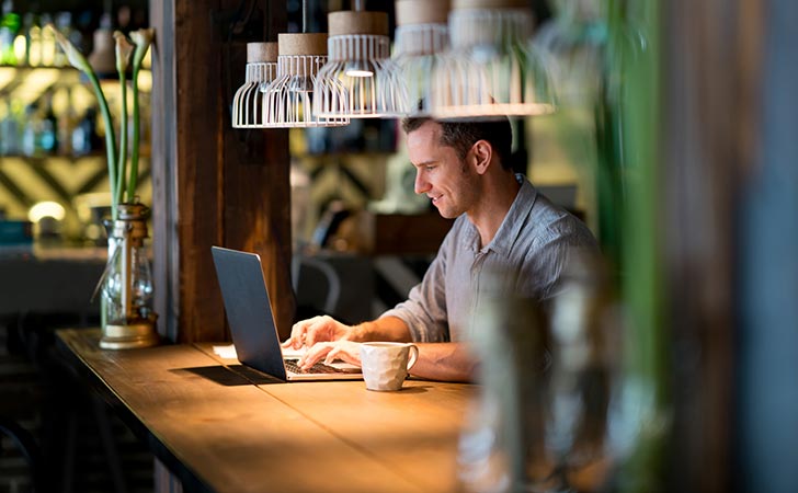 Man working in cafe